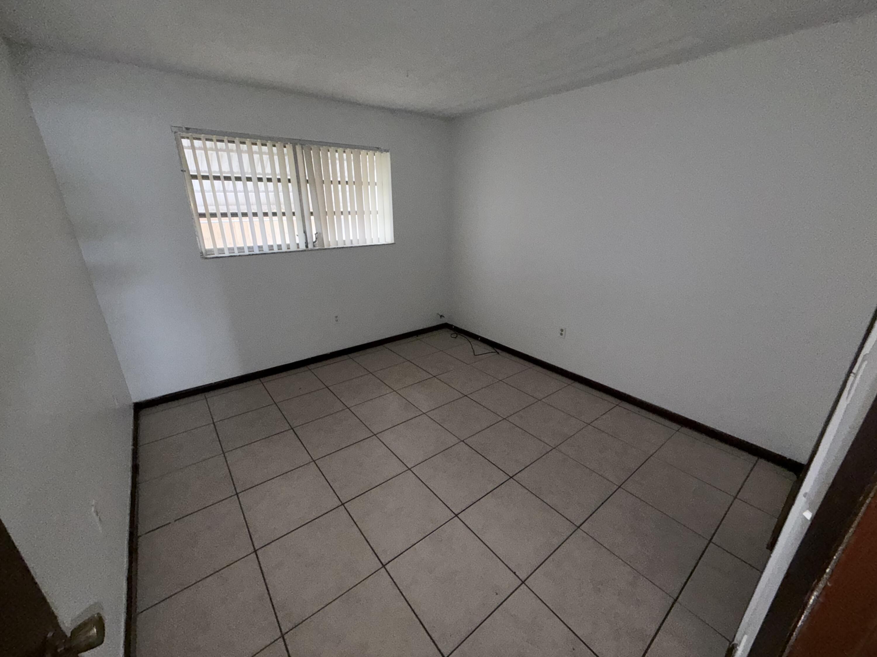 6050 Southwest 27th Street Miramar, FL 33023 - Photo 28 of 40 an empty room with windows