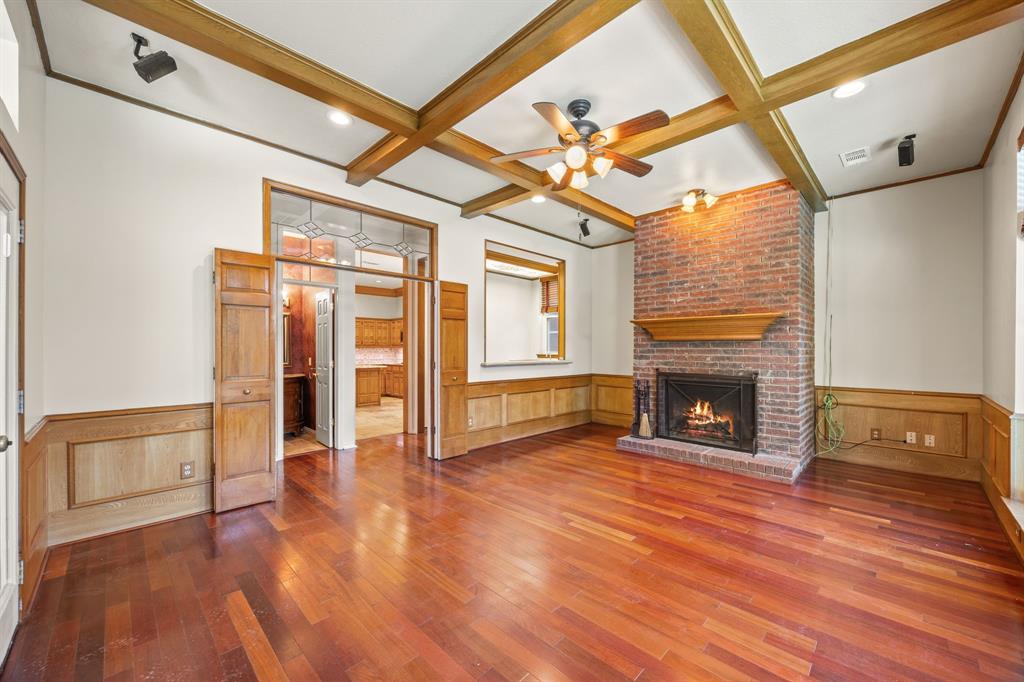 801 Spring Canyon Drive Irving, TX 75063 - Photo 20 of 40 a view of an empty room with wooden floor and a window