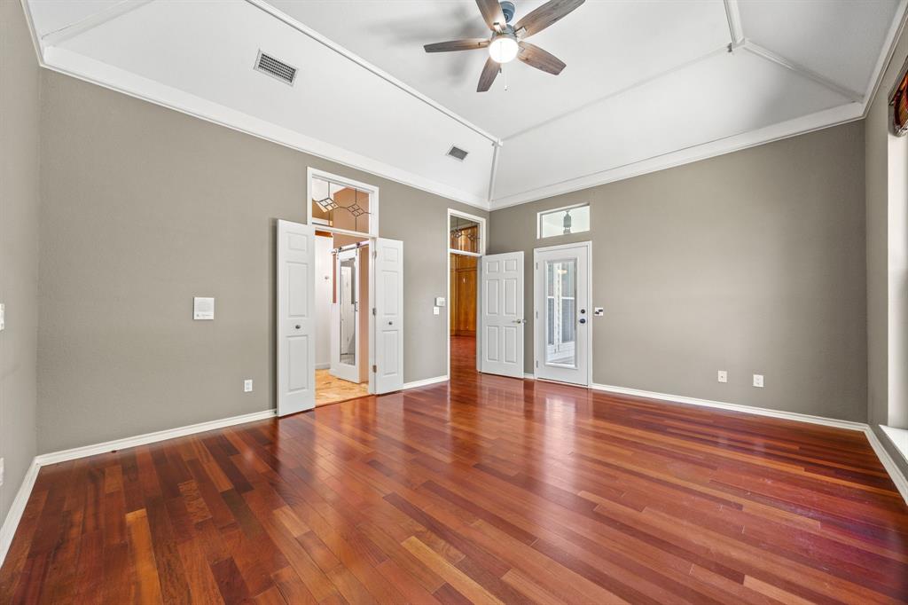 801 Spring Canyon Drive Irving, TX 75063 - Photo 25 of 40 a view of an empty room with wooden floor