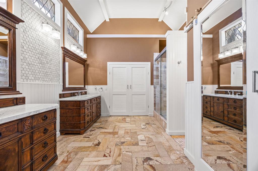 801 Spring Canyon Drive Irving, TX 75063 - Photo 26 of 40 a bathroom with a sink a toilet and a shower
