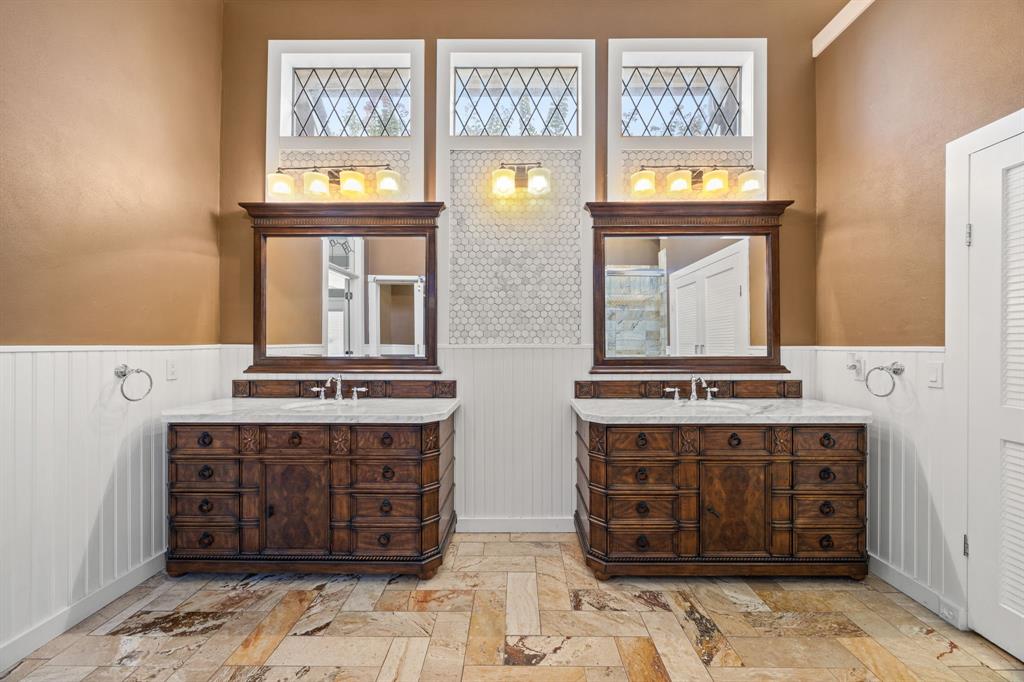 801 Spring Canyon Drive Irving, TX 75063 - Photo 27 of 40 a hall with kitchen island granite countertop a stove a washer and dryer