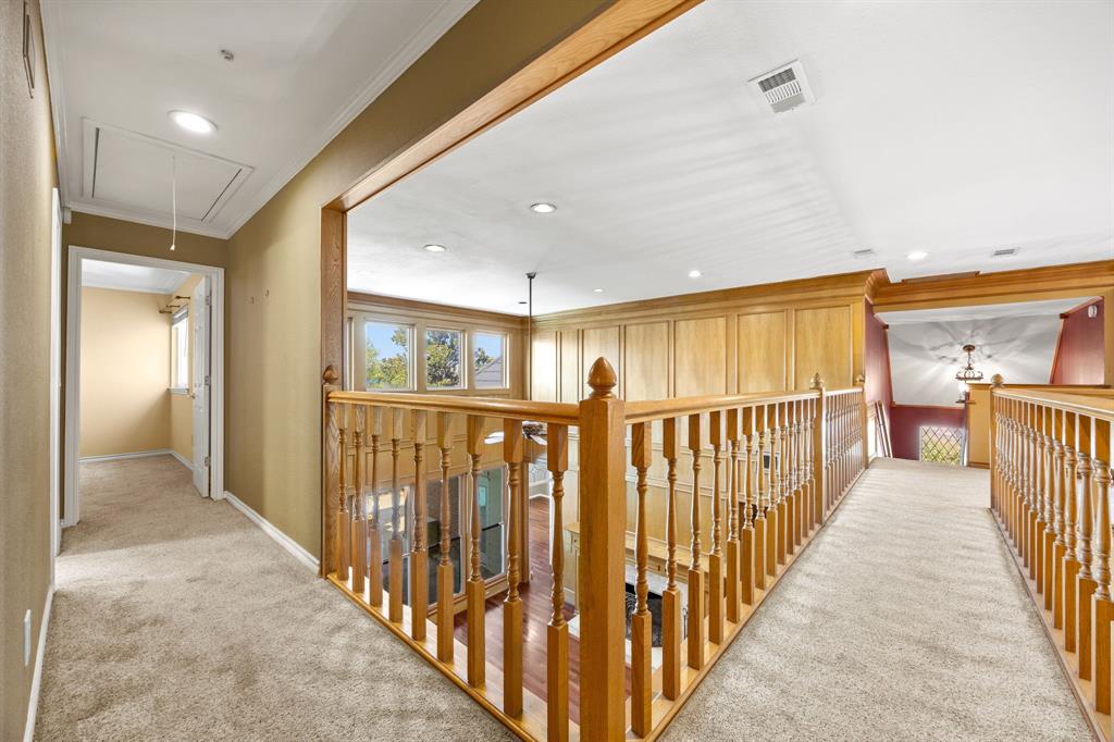 801 Spring Canyon Drive Irving, TX 75063 - Photo 31 of 40 a view of a hallway with wooden floor and staircase