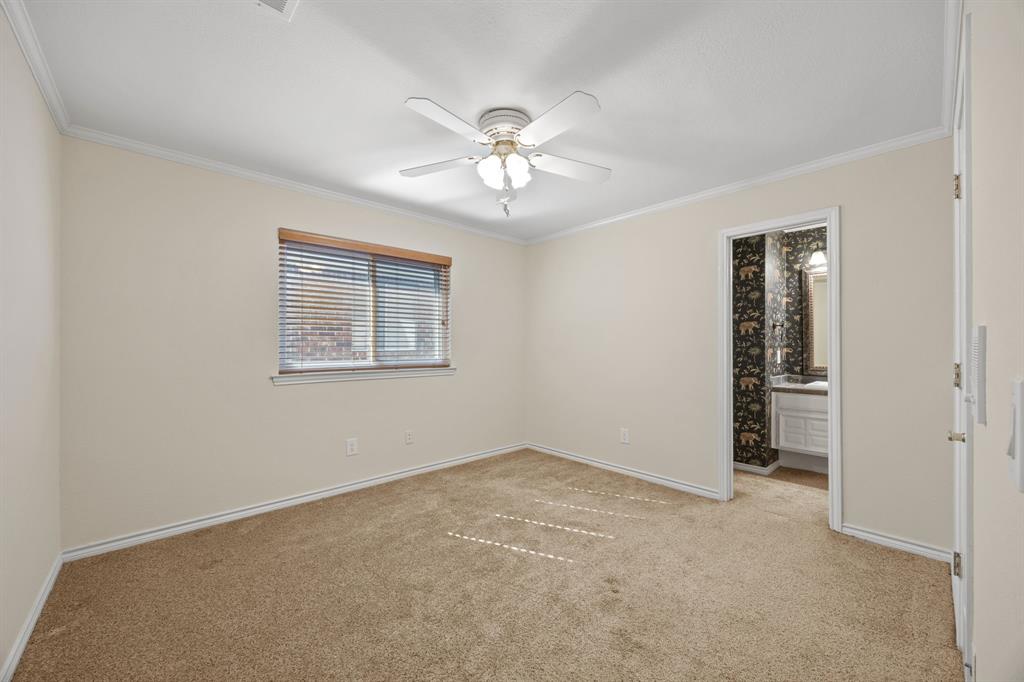 801 Spring Canyon Drive Irving, TX 75063 - Photo 32 of 40 an empty room with fan and windows