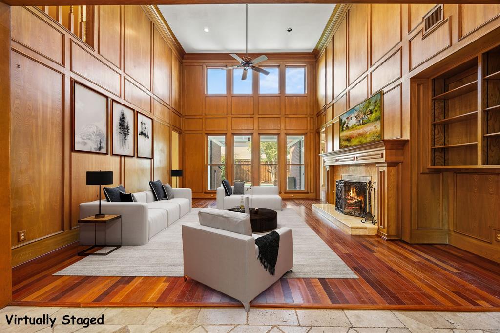801 Spring Canyon Drive Irving, TX 75063 - Photo 4 of 40 a living room with fireplace furniture and a floor to ceiling window