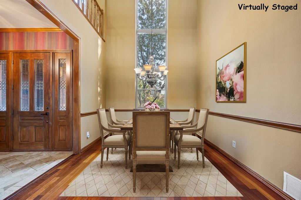 801 Spring Canyon Drive Irving, TX 75063 - Photo 9 of 40 a view of a dining room with furniture window and wooden floor