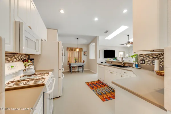 a bedroom with a bed and a flat tv screen