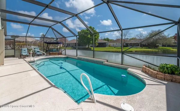 a view of a swimming pool with a porch