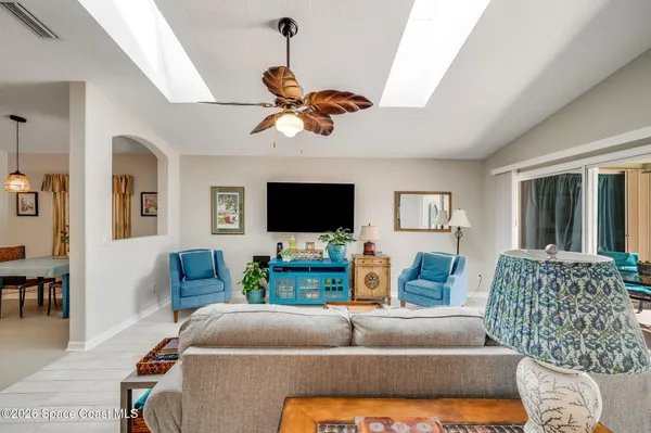 a bathroom with a sink vanity mirror and toilet