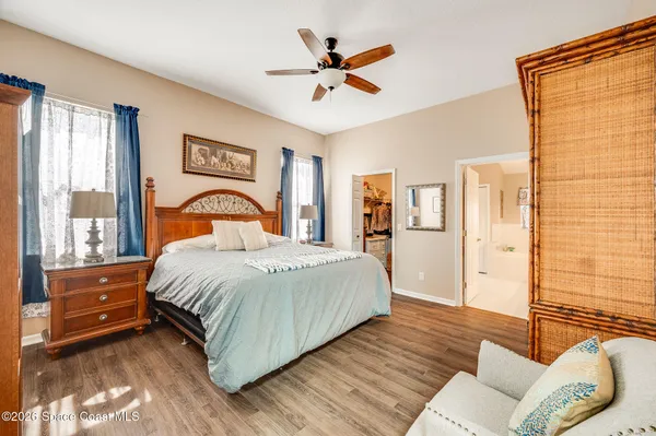 an aerial view of a house with a garden and lake view