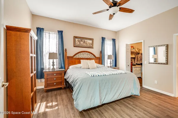 an aerial view of residential houses with outdoor space and swimming pool