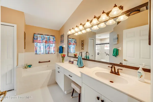 a view of a swimming pool with lounge chairs