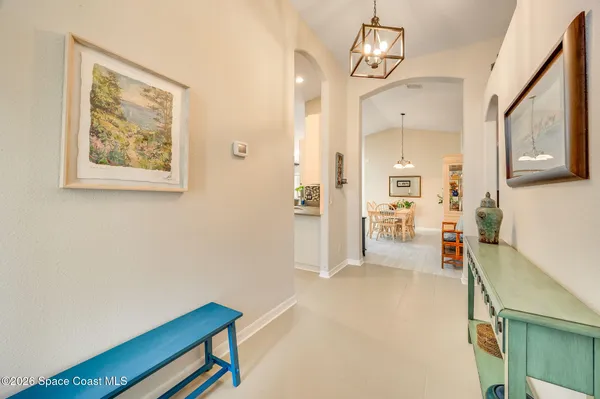 a view of a livingroom with furniture window and wooden floor