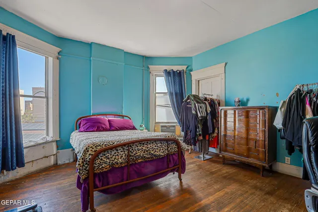 a bedroom with a bed and a closet