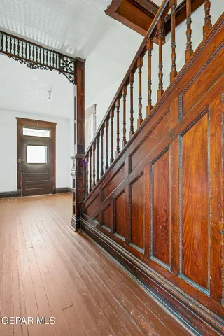 a view of staircase with wooden floor and stairs