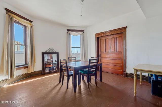 a view of a dining room with furniture and chandelier