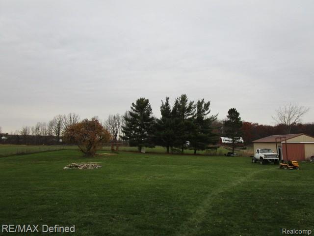 7180 Cook Road Swartz Creek, MI 48473 - Photo 2 of 12 back yard.JPG