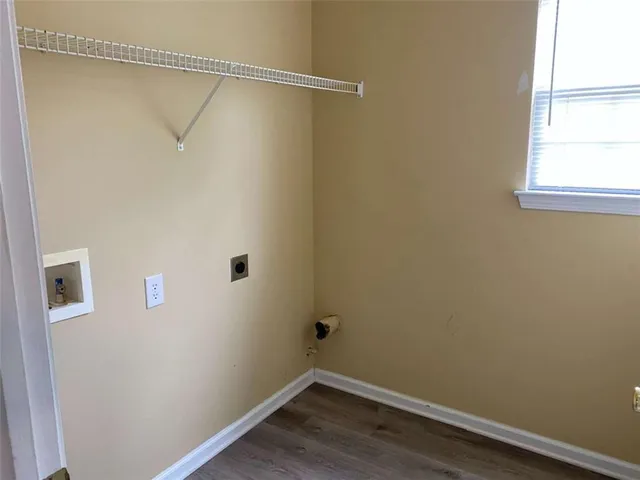 a bathroom with a sink and mirror with toilet