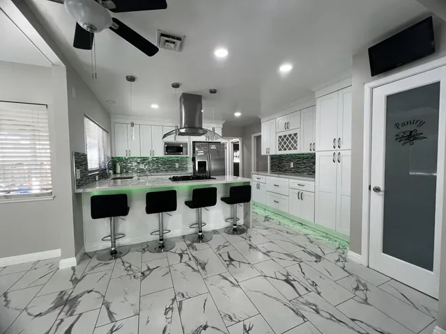 a bathroom with a shower and a sink