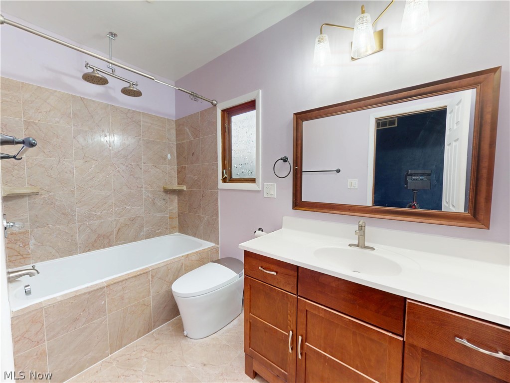 162 South Leavitt Road Amherst, OH 44001 - Photo 29 of 41 Bathroom featuring vanity and tiled shower / bath