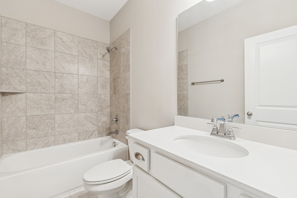 7205 Lake Road Northwest Fairview, TN 37062 - Photo 23 of 28 a bathroom with a sink a toilet and a bathtub