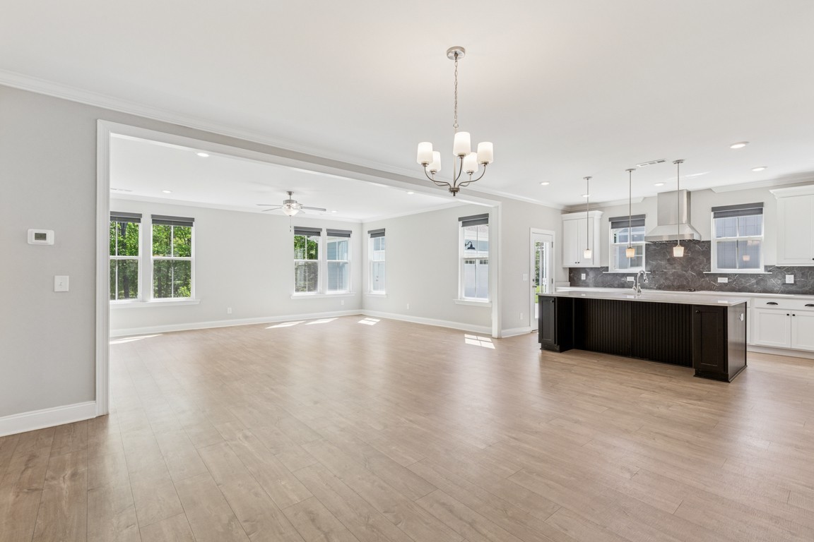 7205 Lake Road Northwest Fairview, TN 37062 - Photo 5 of 28 a large kitchen with kitchen island a sink stainless steel appliances and cabinets