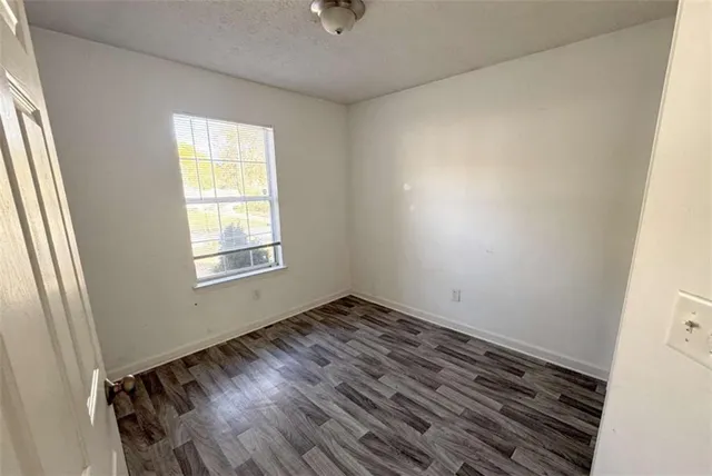 a view of an empty room and window