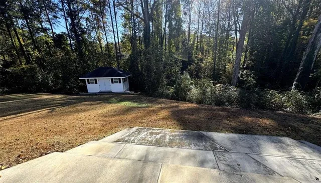 a view of a backyard of a house