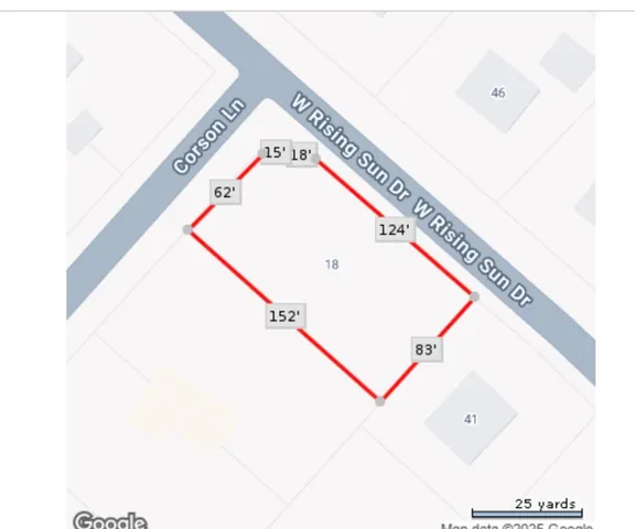 a view of dirt field with trees