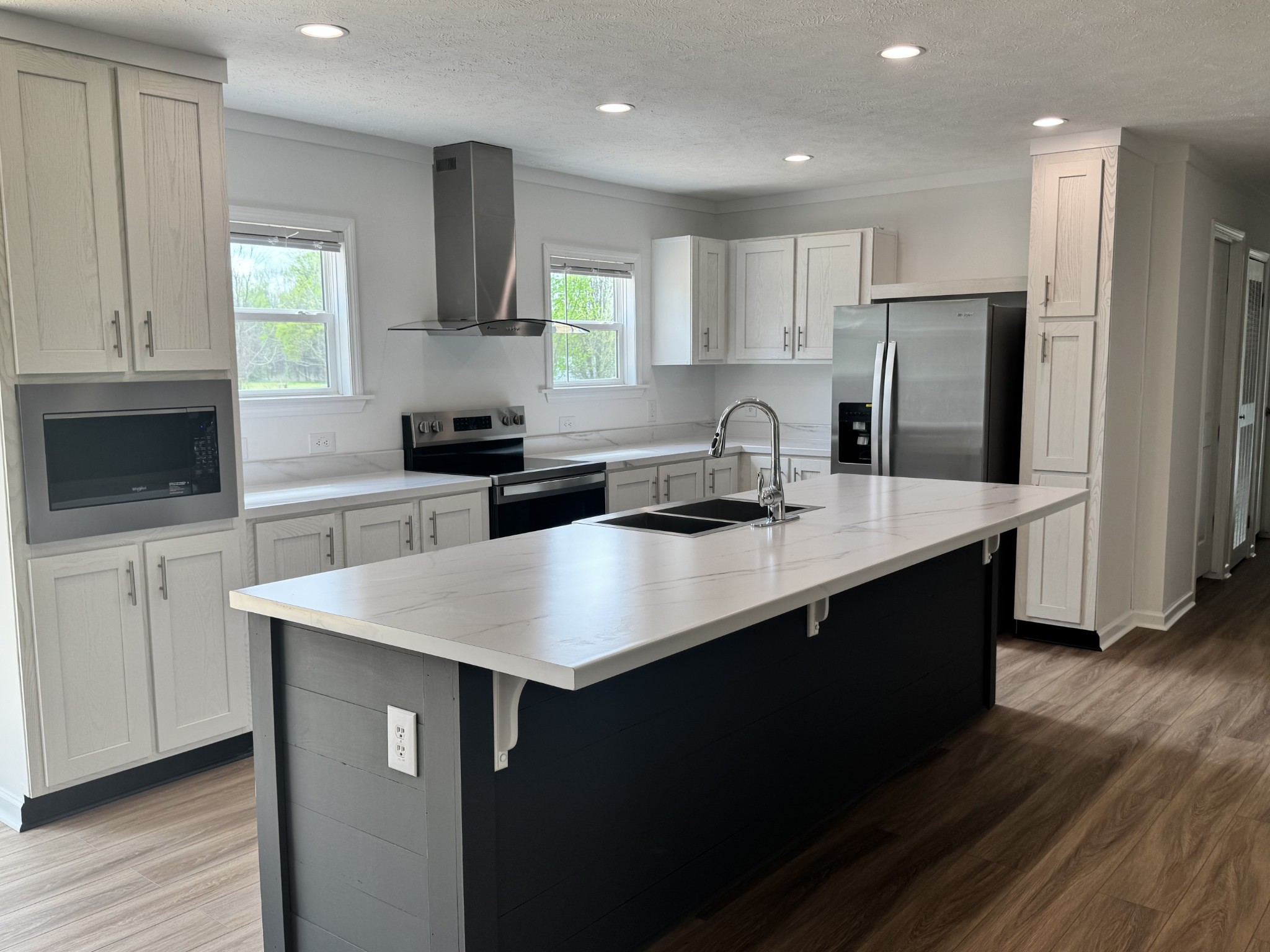 2334 Deans Shop Road Estill Springs, TN 37330 - Photo 5 of 9 a kitchen with stainless steel appliances granite countertop a sink stove and refrigerator