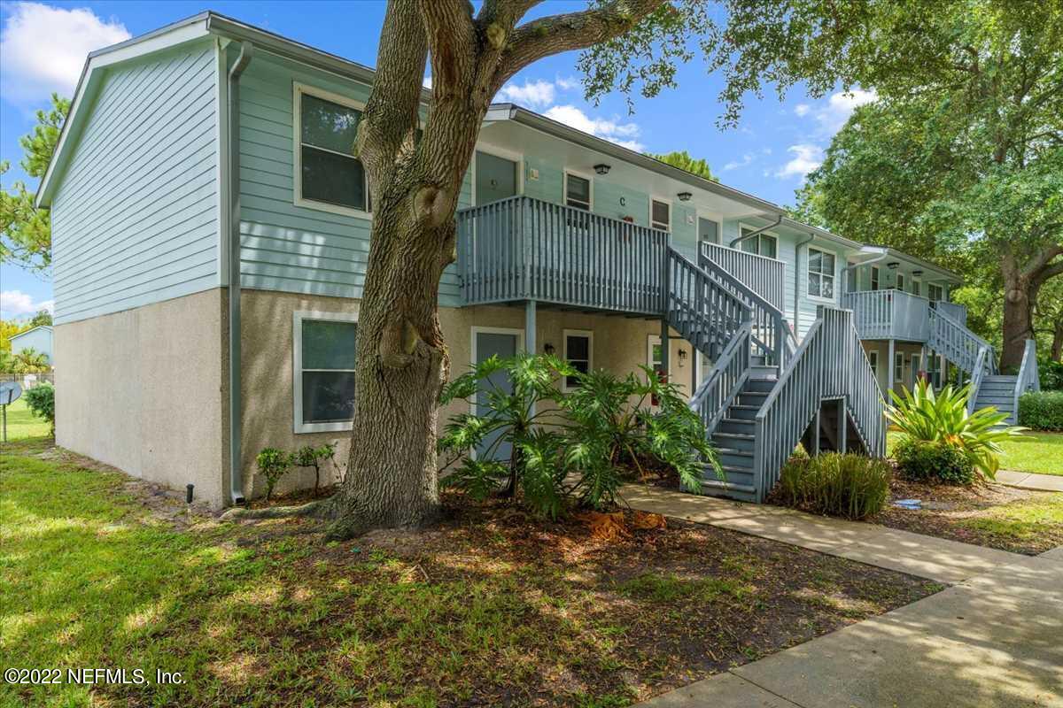 700 West Pope Road, Unit C20 St. Augustine, FL 32080 - Photo 1 of 15 a view of a house with a yard