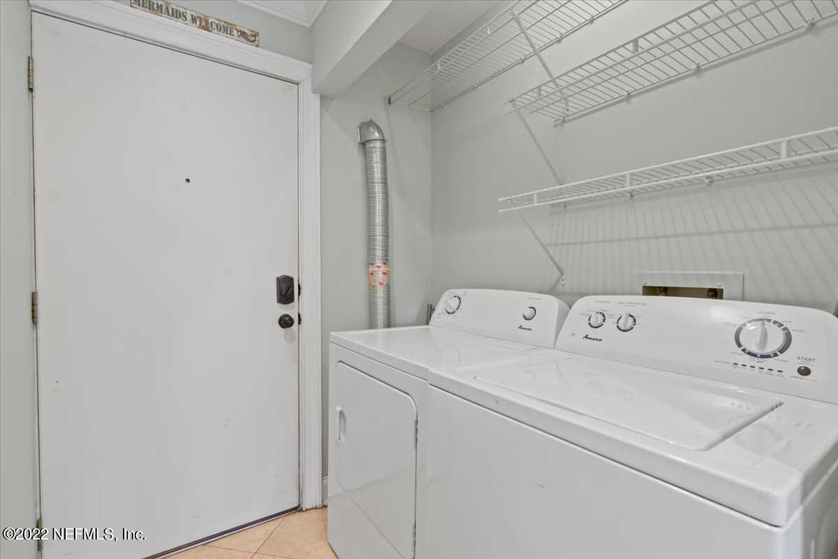700 West Pope Road, Unit C20 St. Augustine, FL 32080 - Photo 13 of 15 a utility room with dryer and washer