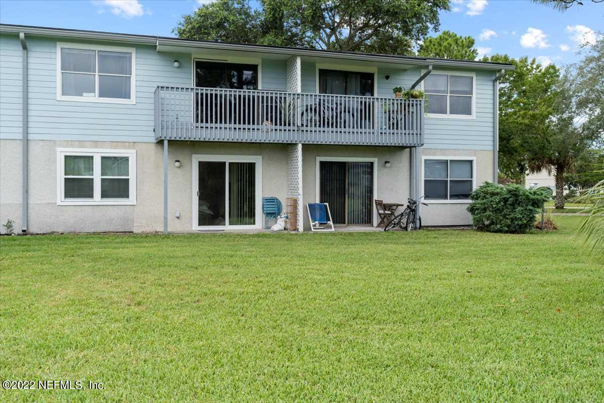 700 West Pope Road, Unit C20 St. Augustine, FL 32080 - Photo 15 of 15 a front view of a house with a garden