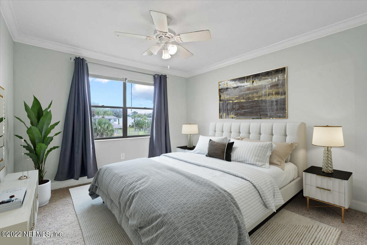 700 West Pope Road, Unit C20 St. Augustine, FL 32080 - Photo 8 of 15 a bedroom with a large bed and a window