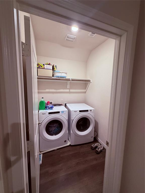 2001 Juniper Pass Way Mesquite, TX 75149 - Photo 9 of 12 Laundry area with dark wood finished floors and washing machine and dryer