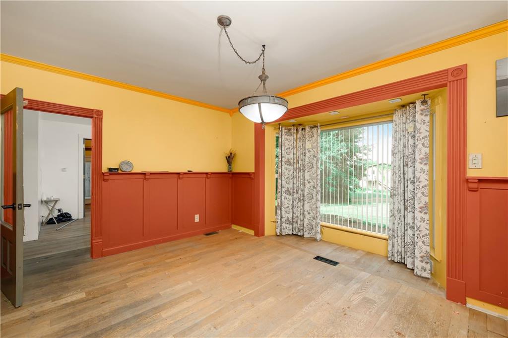 438 Main Street Prospect, PA 16052 - Photo 9 of 46 a view of a room with wooden floor and windows