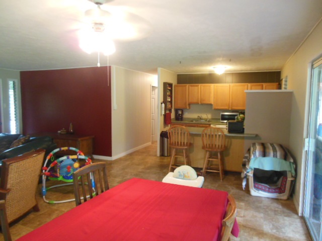 705 Haiku Road Haiku, HI 96708 - Photo 12 of 22 a bed room with a bed and a couch