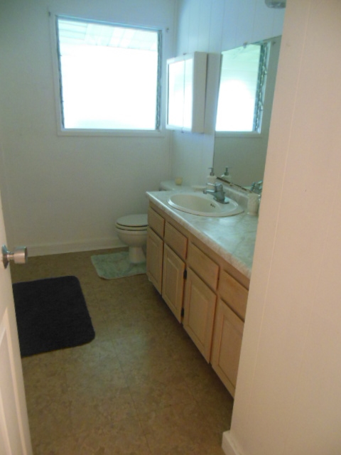 705 Haiku Road Haiku, HI 96708 - Photo 14 of 22 a bathroom with a sink and a toilet