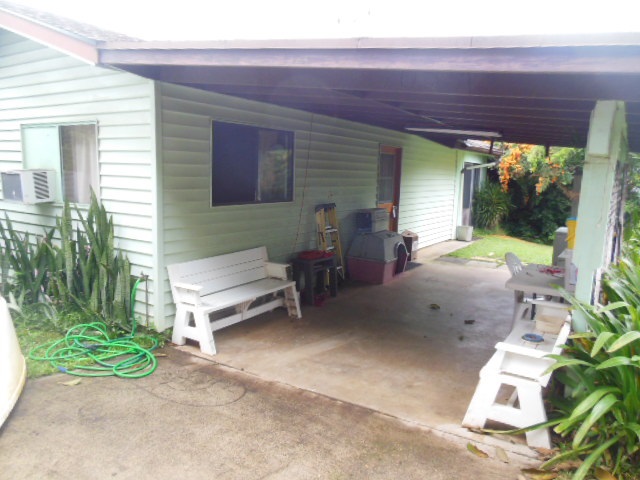 705 Haiku Road Haiku, HI 96708 - Photo 16 of 22 a backyard of a house with yard and outdoor seating