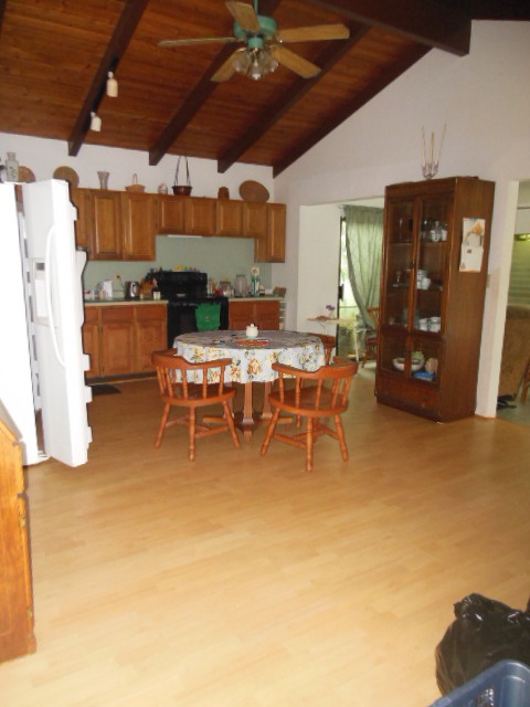 705 Haiku Road Haiku, HI 96708 - Photo 17 of 22 a living room with a couch a dining table and chairs
