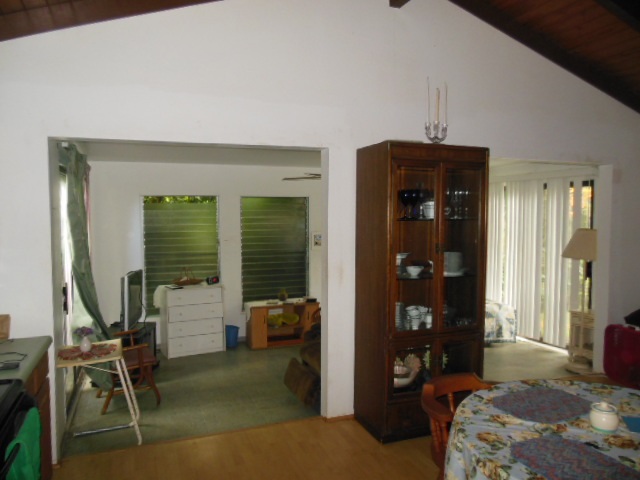 705 Haiku Road Haiku, HI 96708 - Photo 21 of 22 a bedroom with furniture and a window