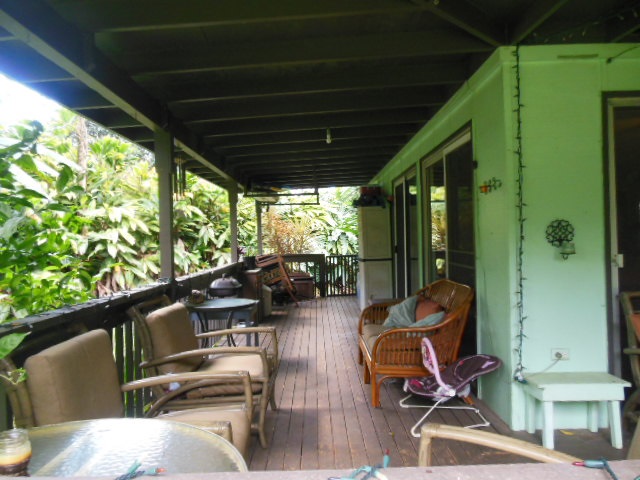 705 Haiku Road Haiku, HI 96708 - Photo 7 of 22 a view of balcony with chairs and wooden floor