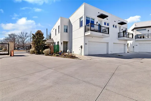 a view of a street with tall buildings