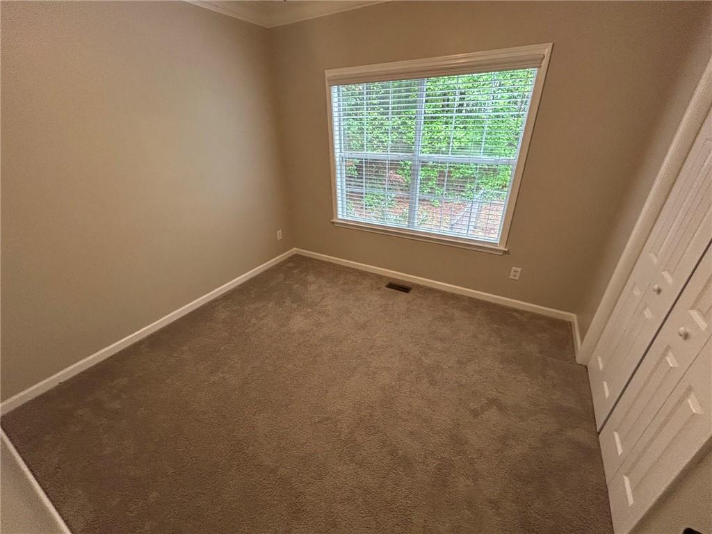 95 Luke Drive Dallas, GA 30132 - Photo 12 of 15 a view of an empty room with a window