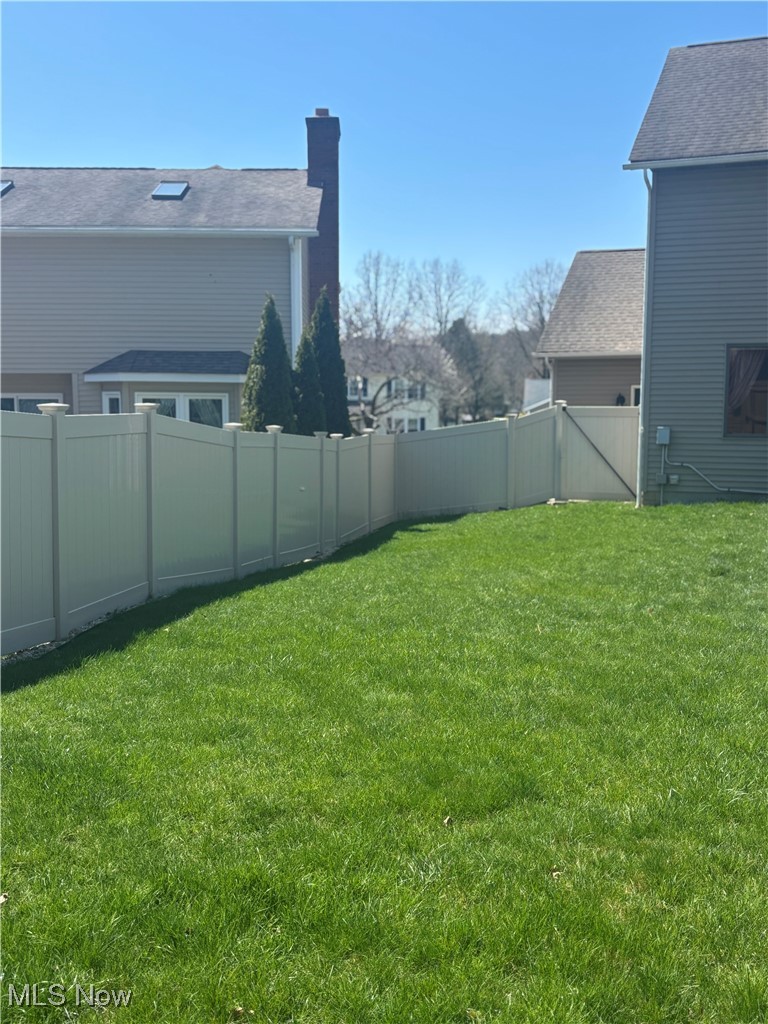 819 Bridge Road Akron, OH 44312 - Photo 10 of 33 View of yard featuring a fenced backyard