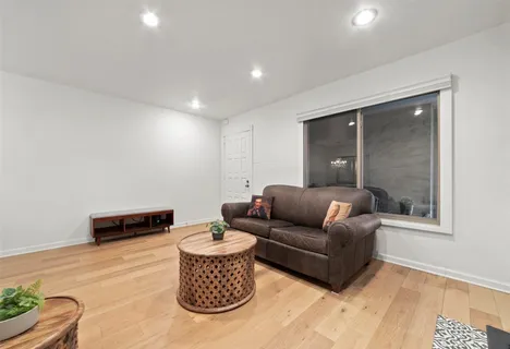 a living room with furniture and a rug