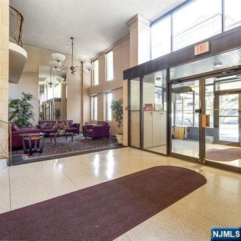 160 Overlook Avenue, Unit 18D Hackensack, NJ 07601 - Photo 2 of 14 a large room with pool table and windows