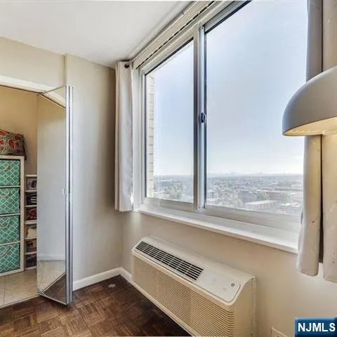 a view of an empty room and window