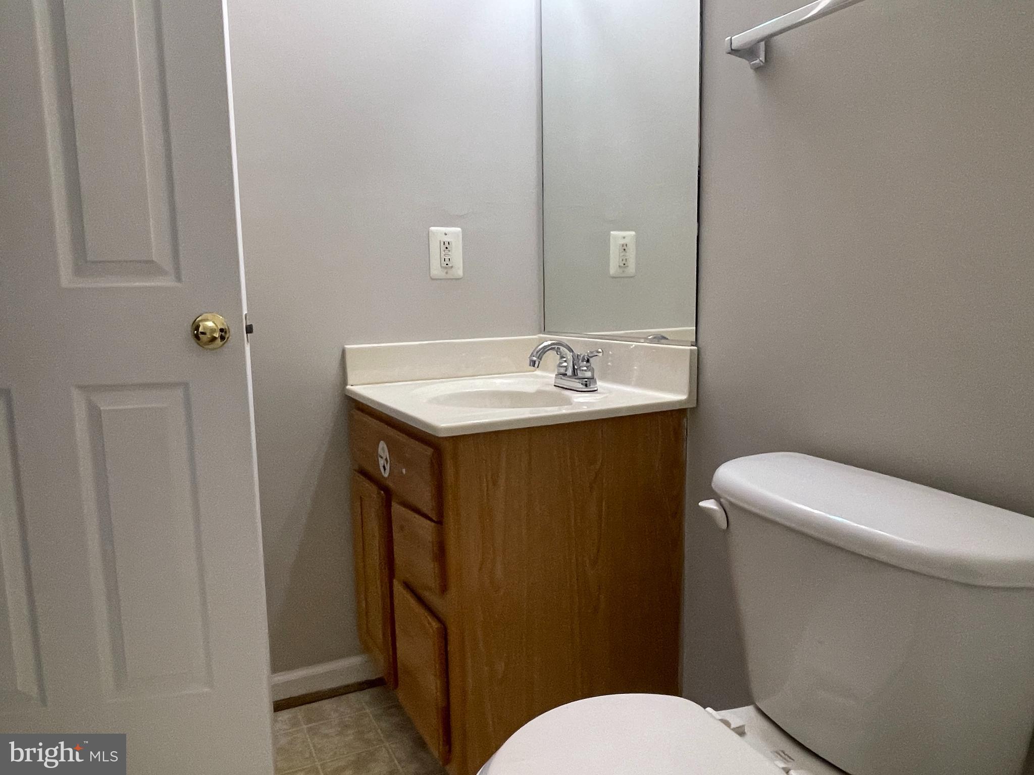27 Townes Place Fredericksburg, VA 22405 - Photo 13 of 34 a bathroom with a toilet sink vanity and mirror