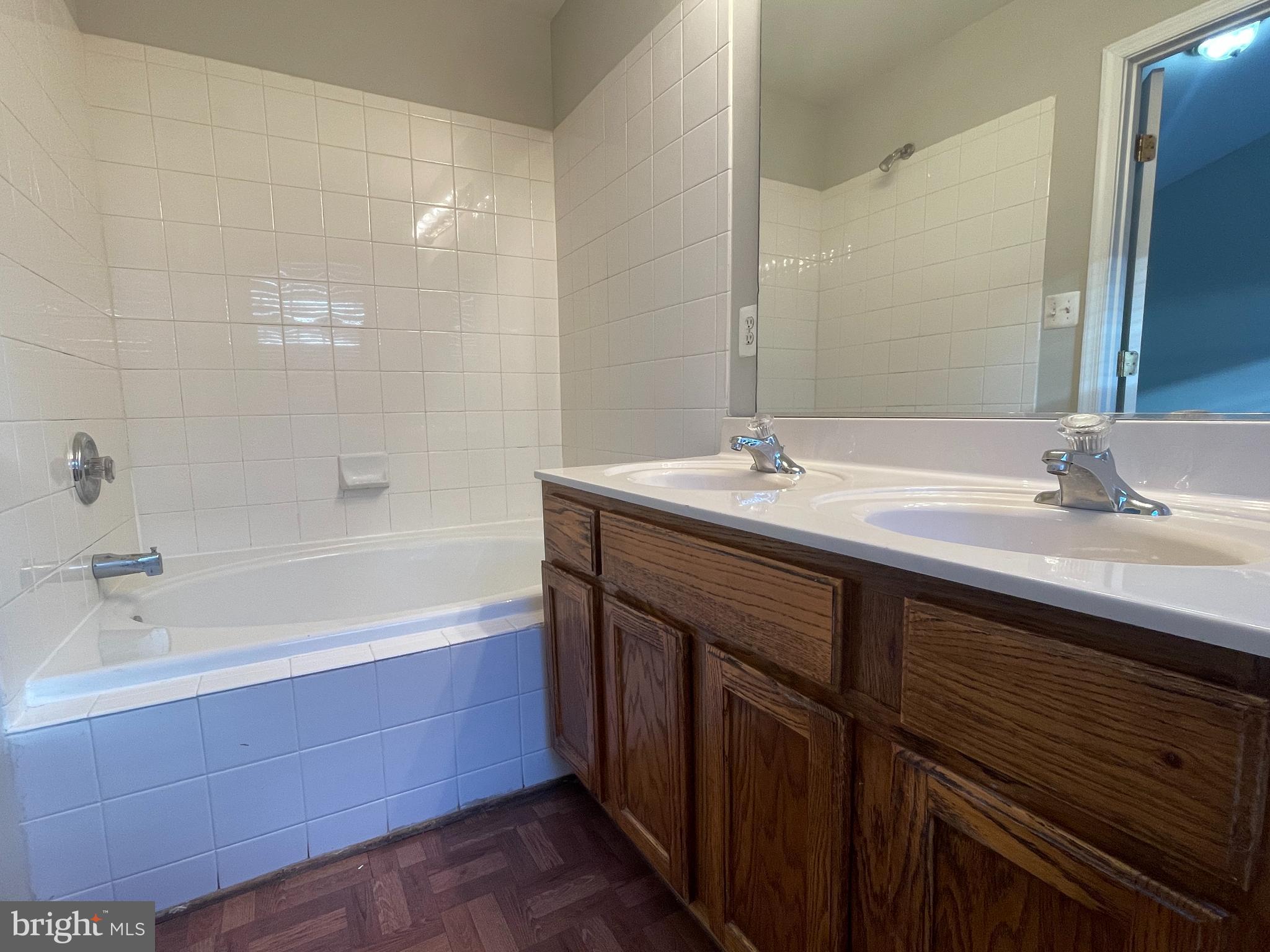 27 Townes Place Fredericksburg, VA 22405 - Photo 27 of 34 a bathroom with a sink double vanity granite tub shower and a mirror