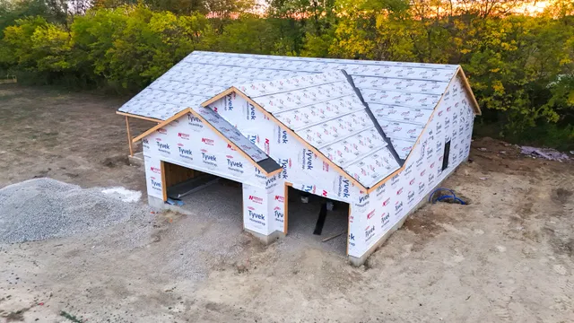 a view of a house with a yard and roof